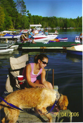 girl with dog on dock